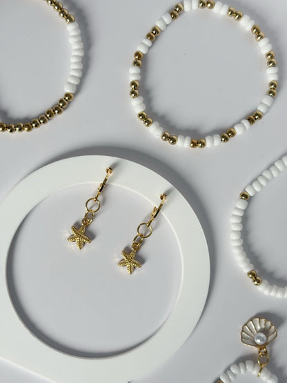 Small Gold Starfish Earrings On An 18K Gold Hoop